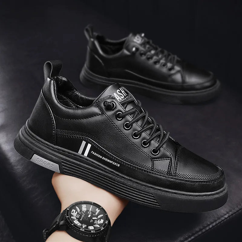 Men's low-top skate shoes with elastic band, microfiber upper, and round toe in black and white.