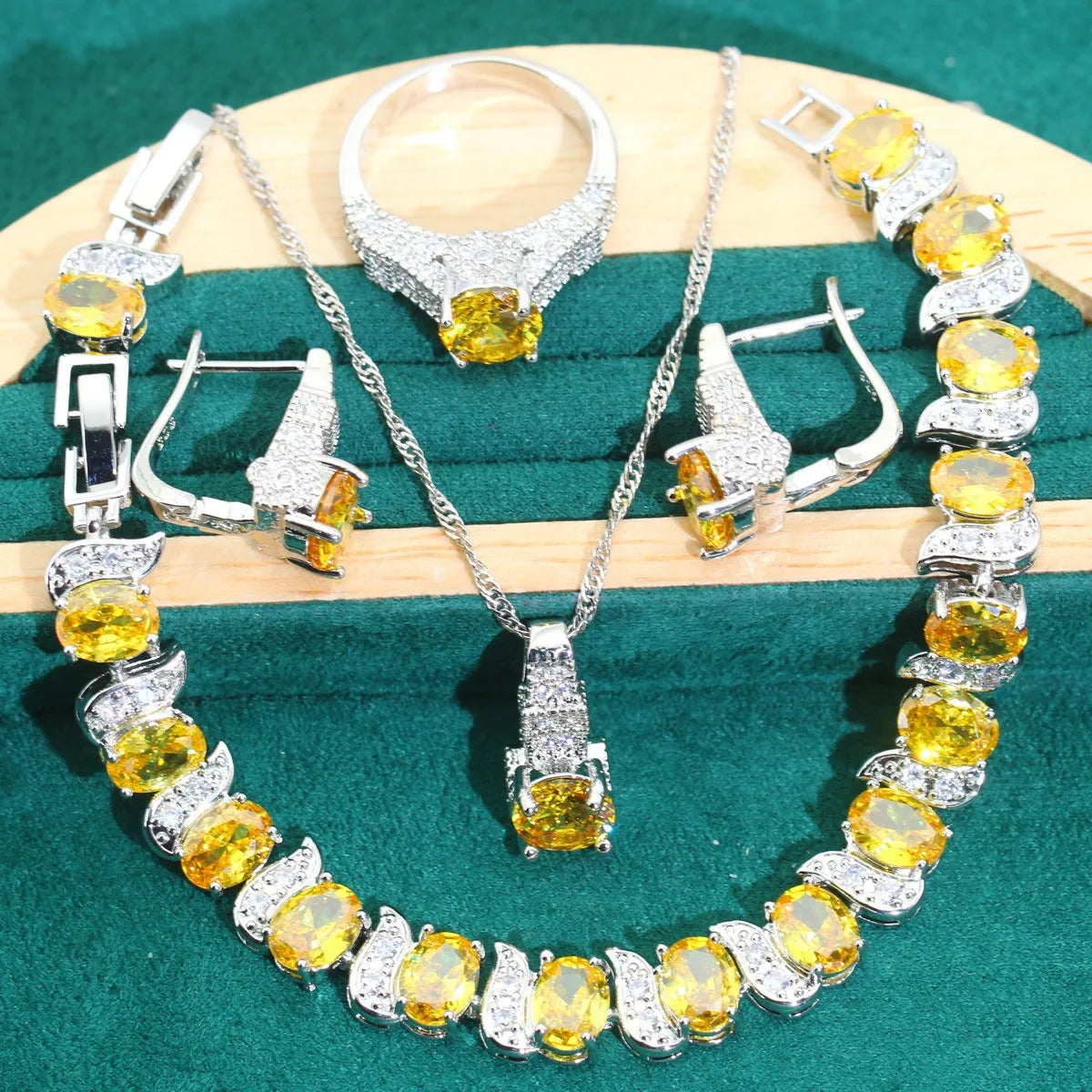 Bridal zircon necklace, bracelet, earrings, and ring four-piece jewellery set in alloy with water wave chain design.