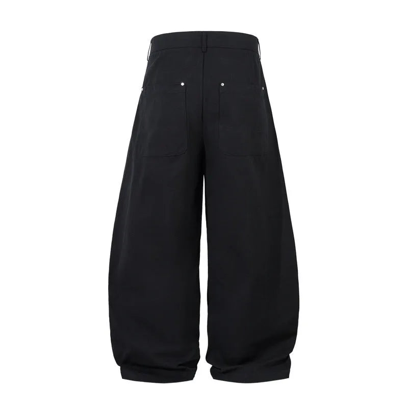 Men's black pleated casual trousers with wide-leg loose fit and machete pleat detailing