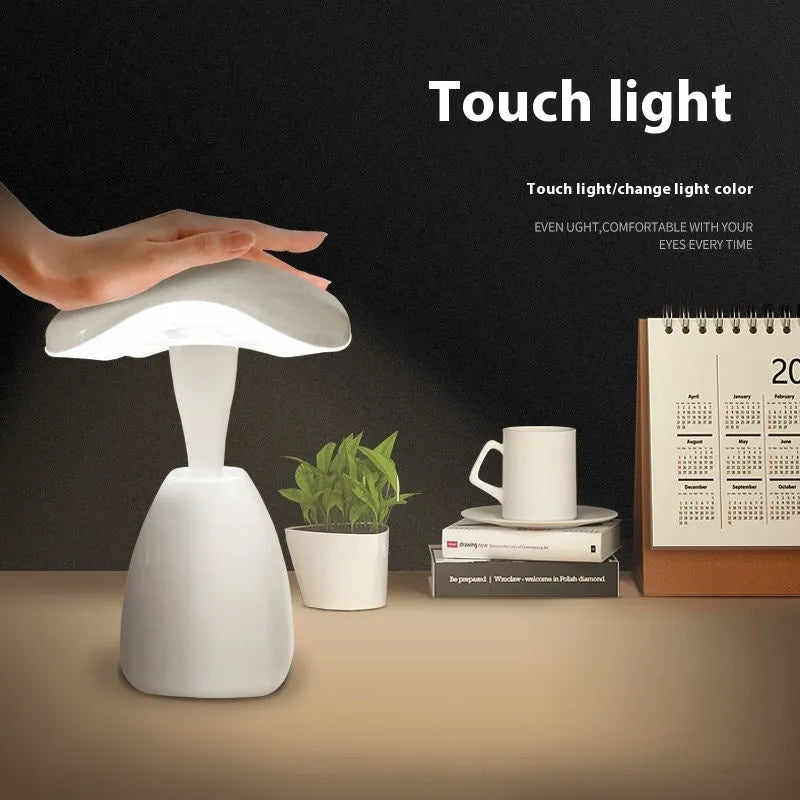 White modern LED desk lamp with touch controls and built-in battery for bedside use