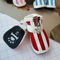 Set of four blue cloth dog shoes with zippers for small breed pets on a white background