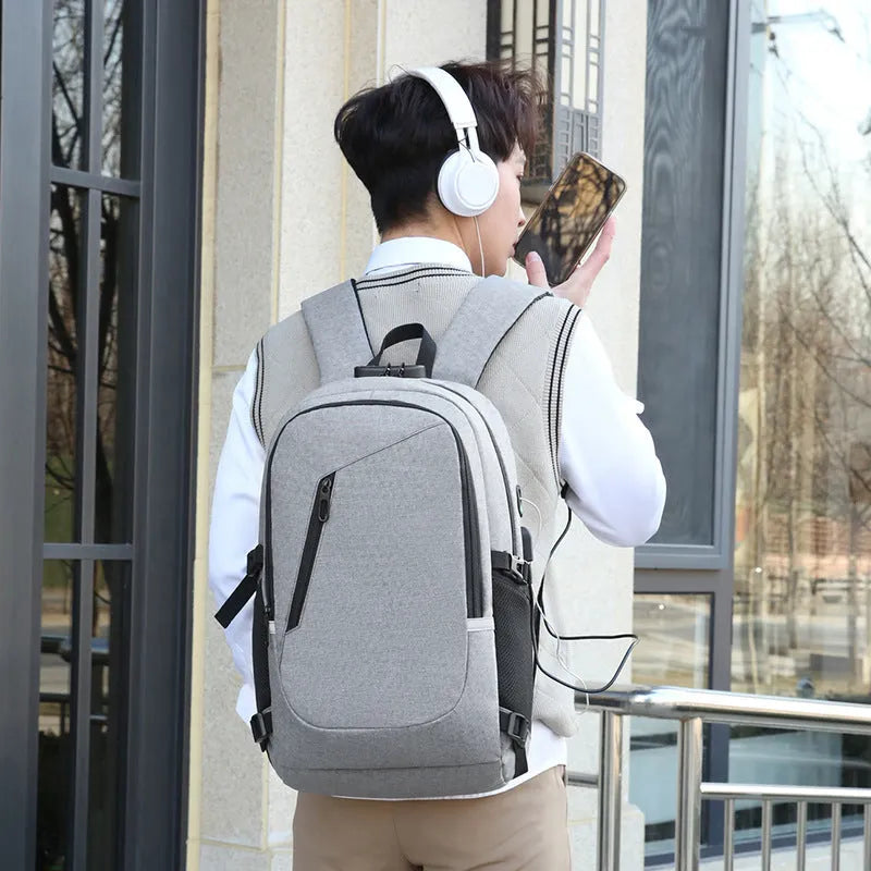 Men's solid colour oxford cloth computer backpack with street style, shown in blue