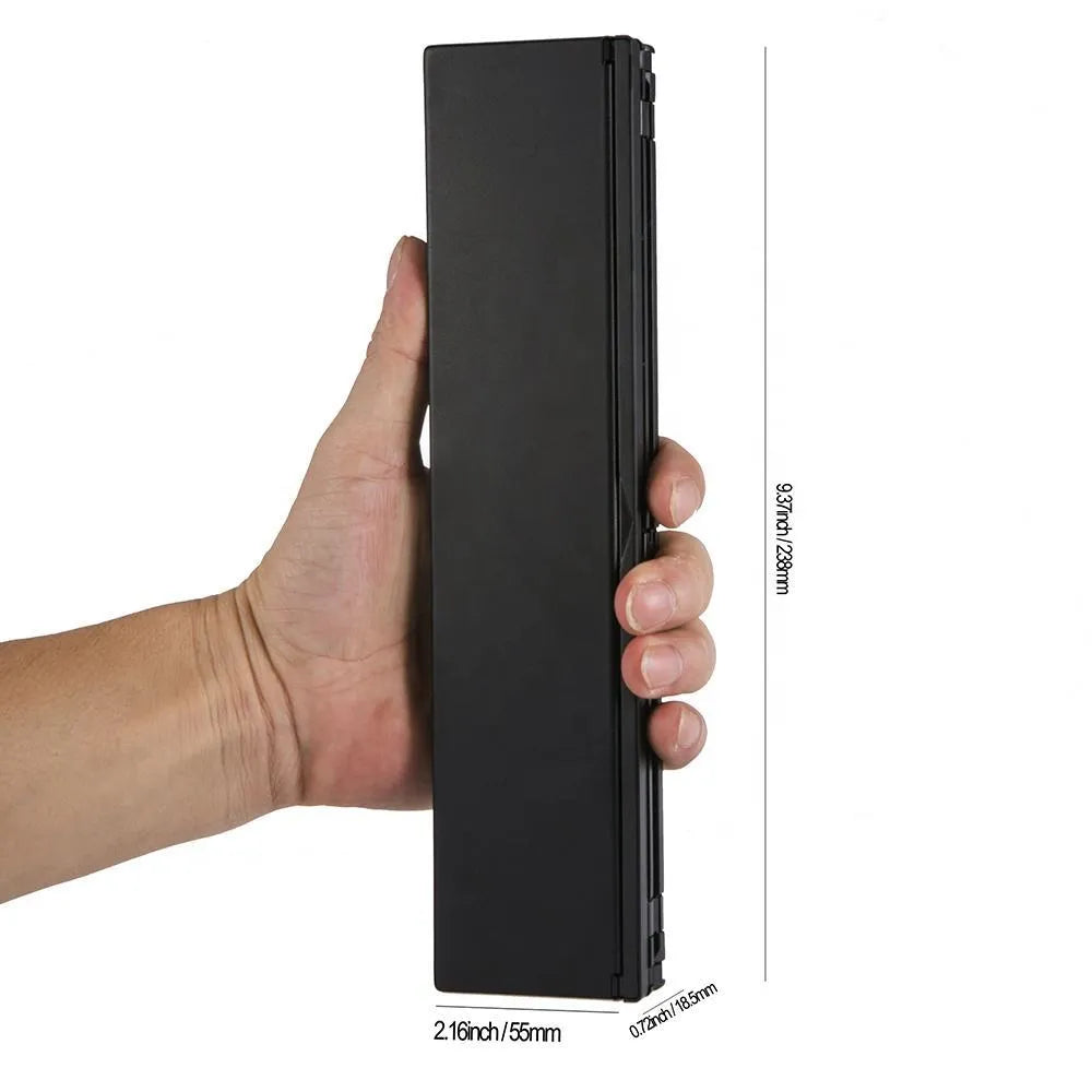 Black foldable Bluetooth keyboard for tablets with aluminium bottom and wrist support