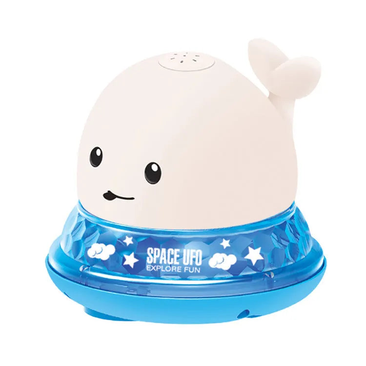 White and blue whale bath toy spraying water with LED lights illuminated