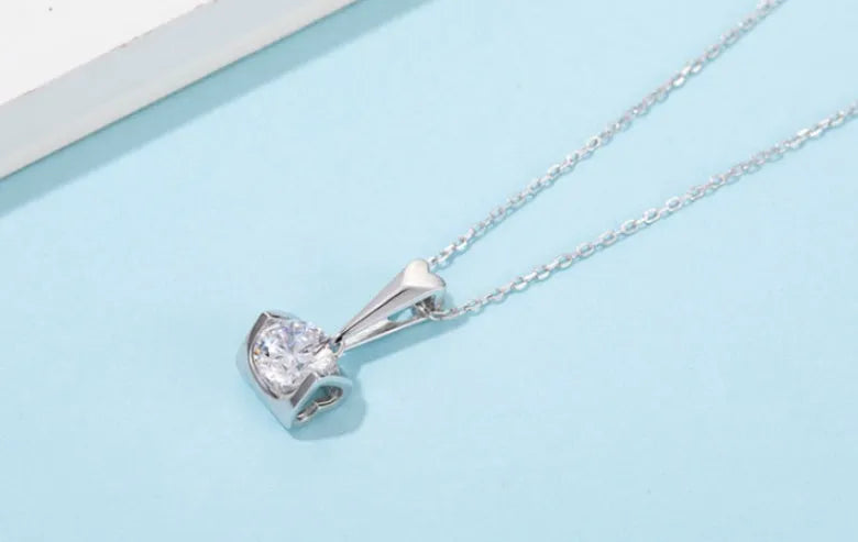 S925 sterling silver moissanite pendant necklace and stud earrings two-piece set on white background