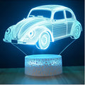 Black LED touch table lamp with acrylic shade and USB cable on wooden desk