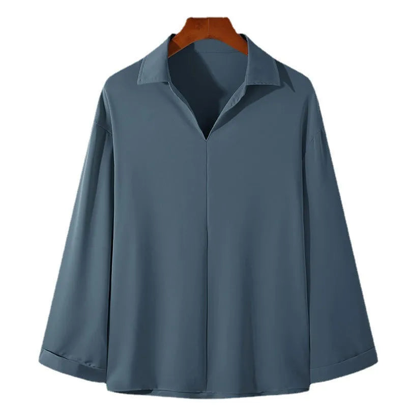 Men's loose lapel casual long sleeve shirt in a solid colour on a hanger