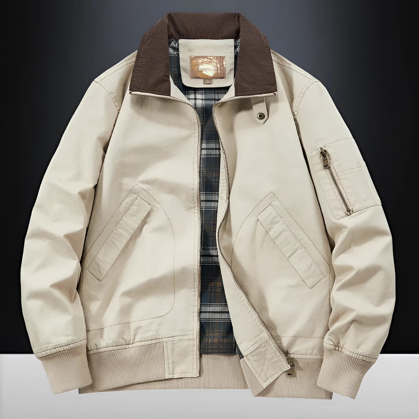 Men's camel coloured washed cotton baseball-style flight jacket on a hanger
