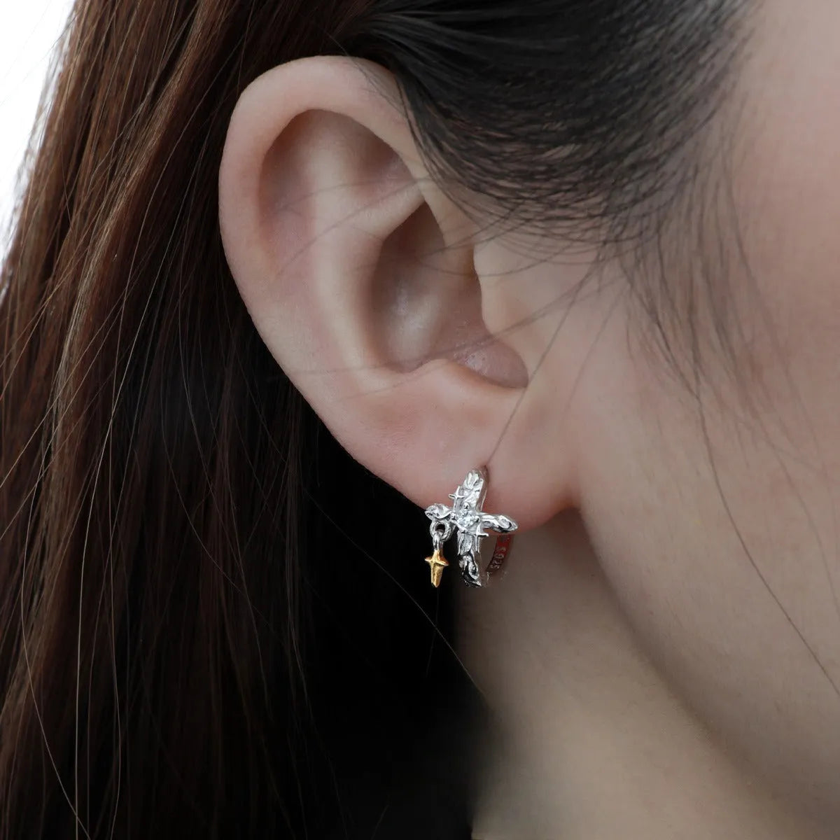 Geometric cross earrings with round elements in sterling silver with white gold colour finish