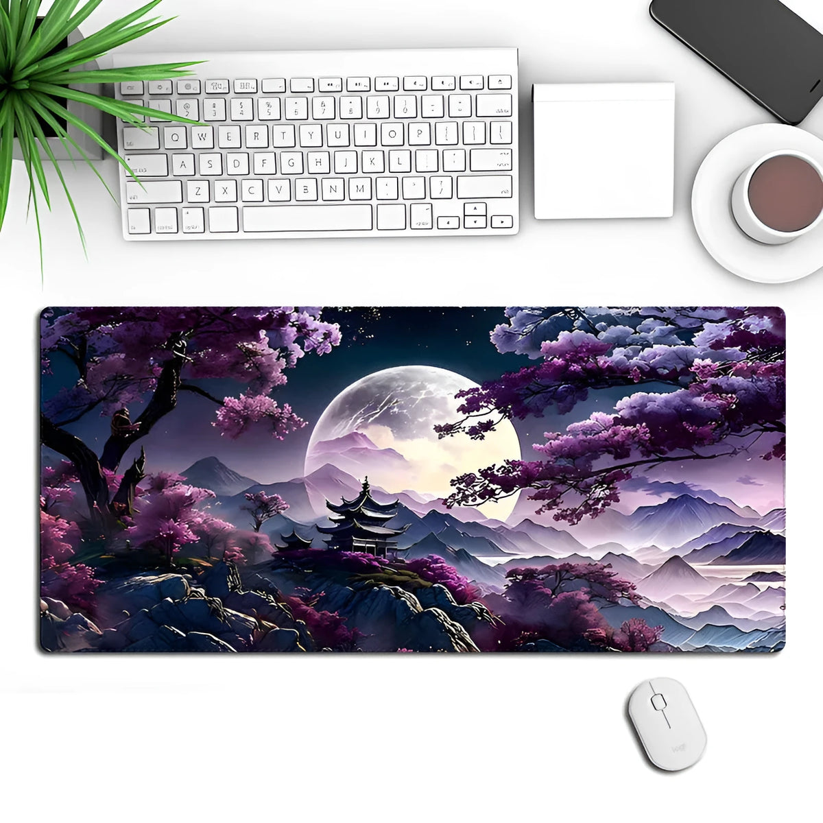 Large black gaming mouse pad with stitched edges and a printed pattern on a desk
