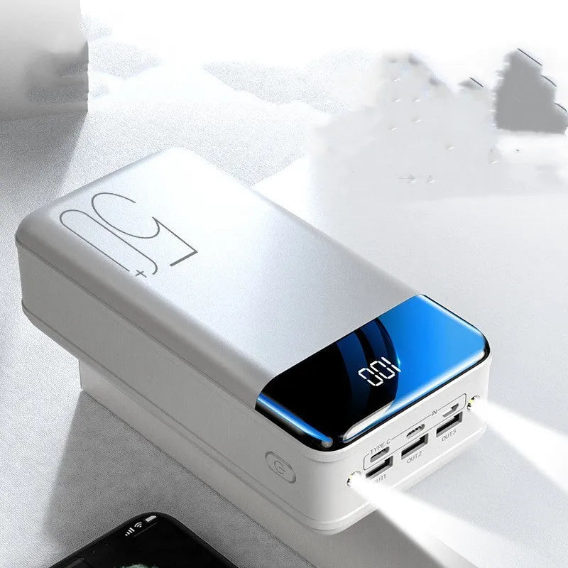 Large 50000mAh capacity power bank with three output ports in black plastic casing