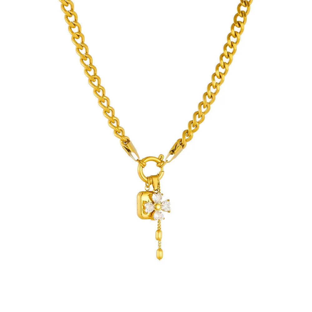 Tassel stainless steel bracelet and necklace set for women with flower and butterfly motifs on a white background