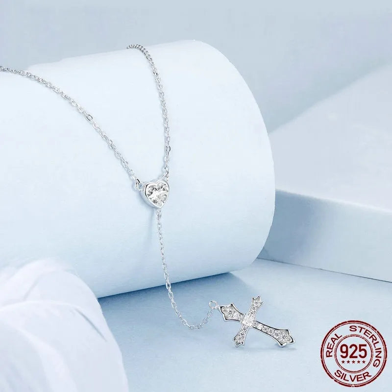 Silver necklace with a small cross pendant on an O-ring chain, shown in colour BSN384.