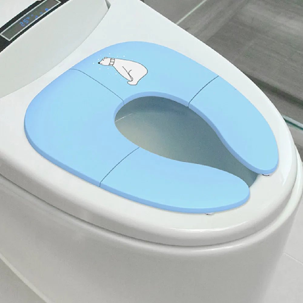 Foldable baby travel potty seat in pink, yellow, blue colours on white background