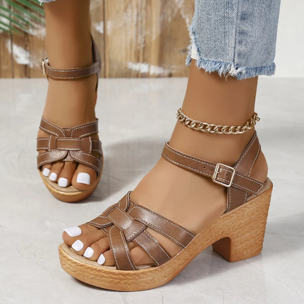 Black plus size women's Roman sandals with peep toe, chunky block heel, and ankle-strap buckle.