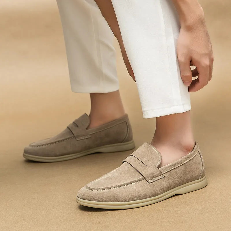 Men's beige leather slip-on casual shoes with a round toe and rubber sole on a white background