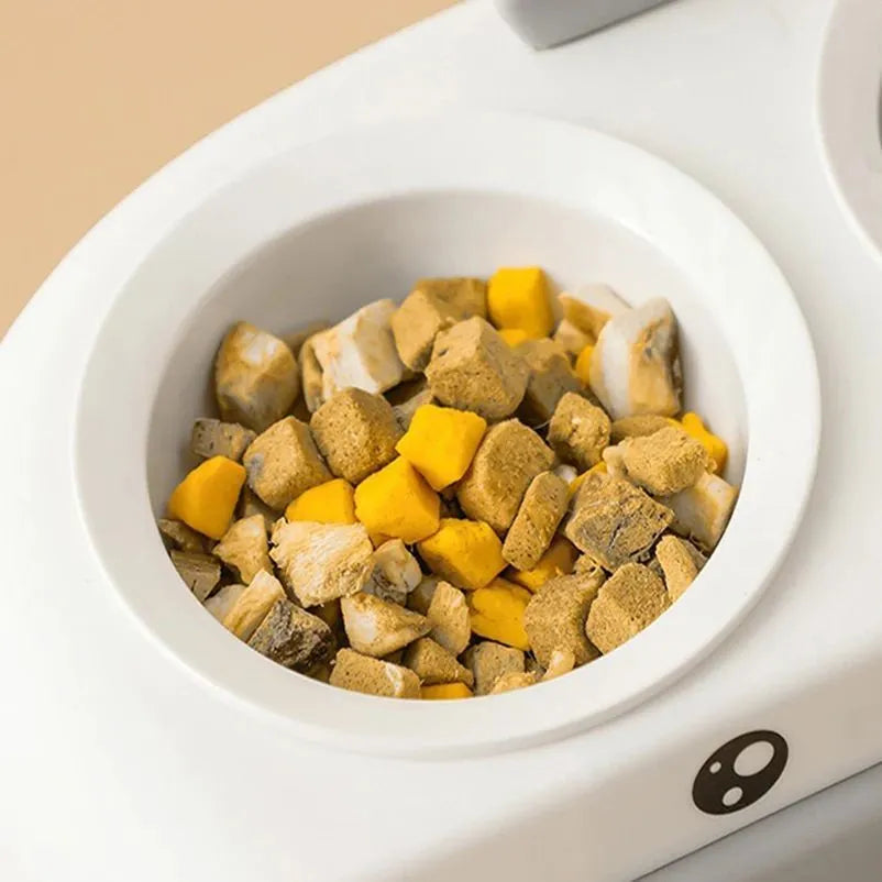 Duck design double pet bowl feeder tray in grey, pink, or yellow with plastic or stainless steel bowls for cats and small dogs.