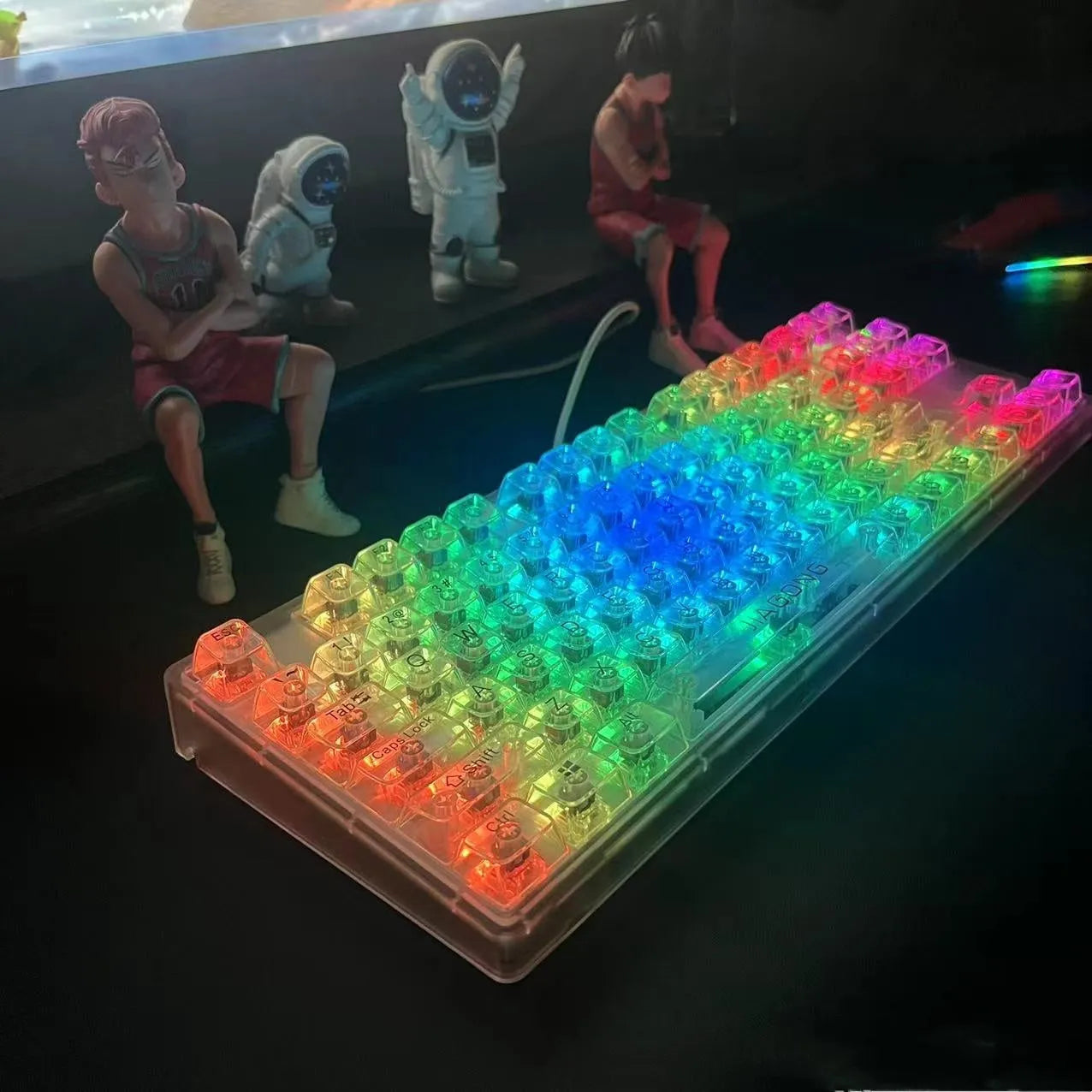 Transparent plastic keyboard key caps arranged as complete 132-key set for mechanical keyboard replacement