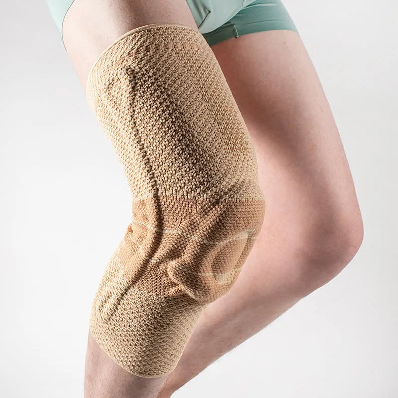 Black and blue adult sports knee pad made of nylon and spandex for basketball and running.