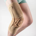 Black and blue adult sports knee pad made of nylon and spandex for basketball and running.