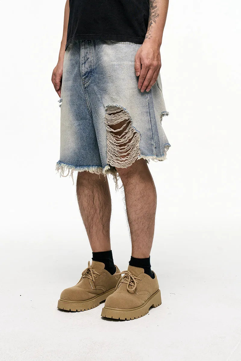 Light blue baggy denim shorts with wide leg cut and zipper fly