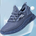 Men's beige casual sneaker with mesh lining, synthetic leather upper, and flat EVA sole on a plain background.