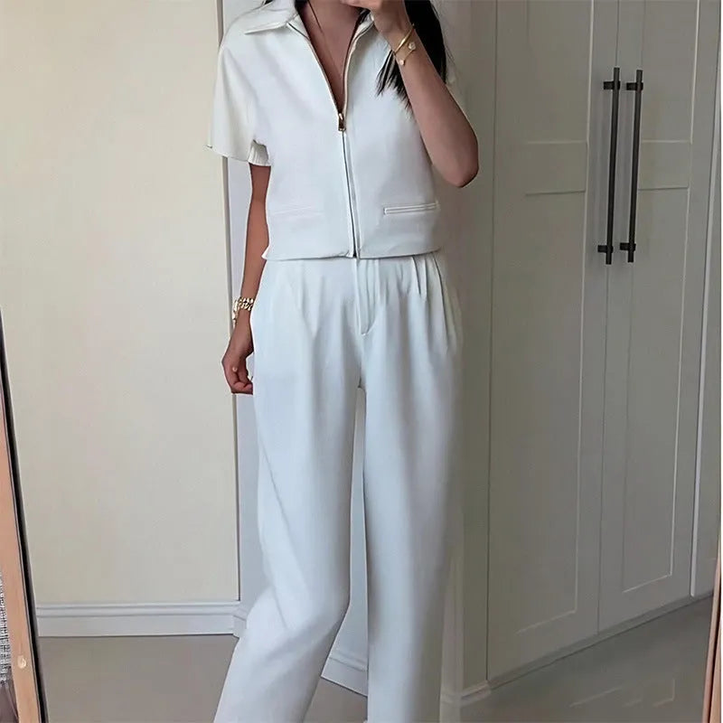 Loose-fit short-sleeve casual top in polyester, shown in white, black, and yellow colour options.