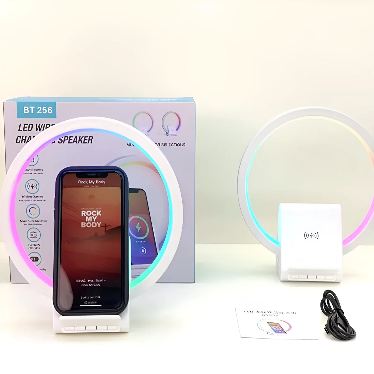 White rectangular Bluetooth speaker with wireless charging surface and ambient lighting