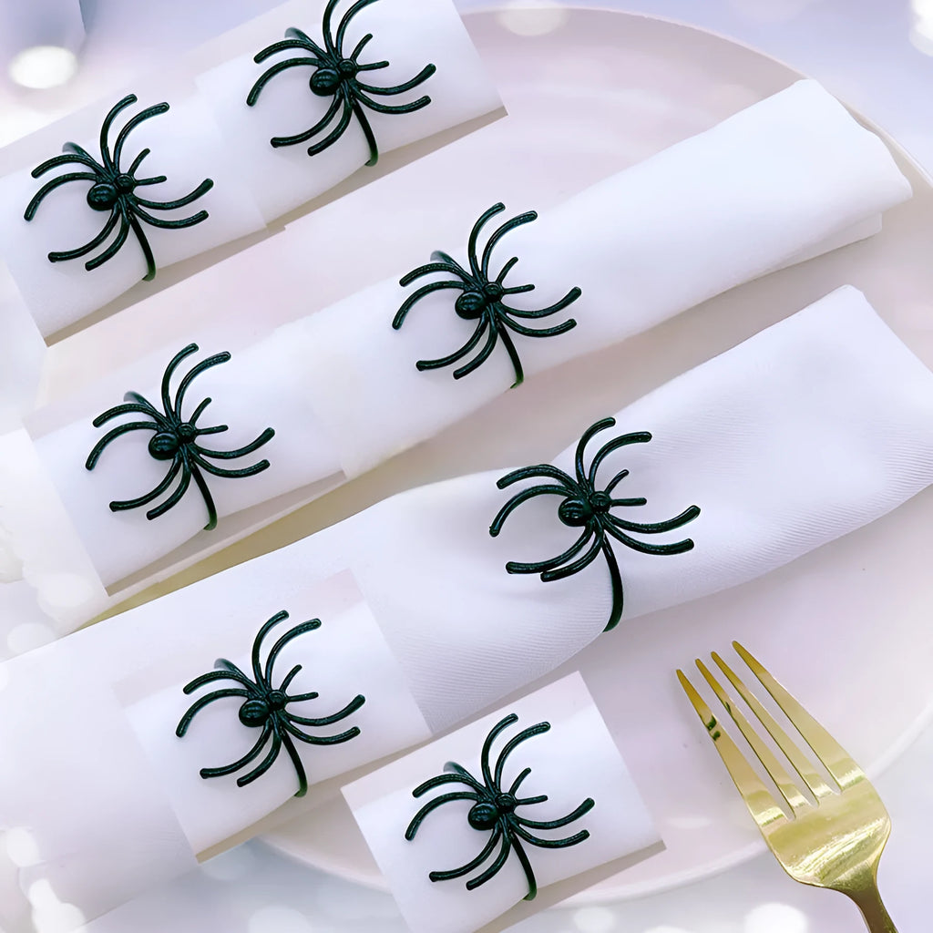 Six black spider-shaped alloy napkin rings for Halloween table decoration.