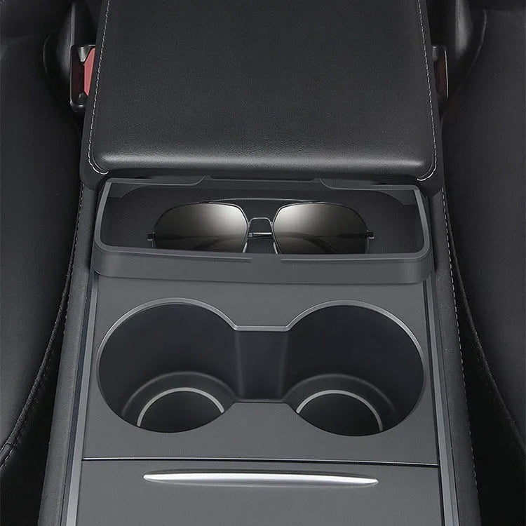 Black silicone glasses case mounted in Tesla Model 3 or Y armrest compartment for organised storage