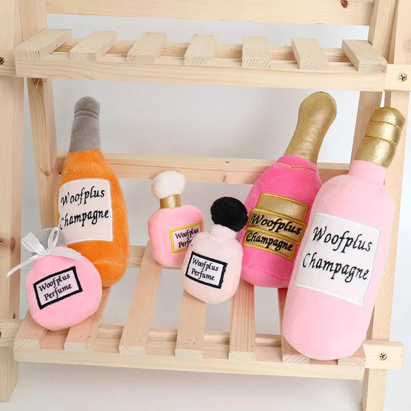 Soft green plush wine bottle pet toy for dogs and cats on a white background.