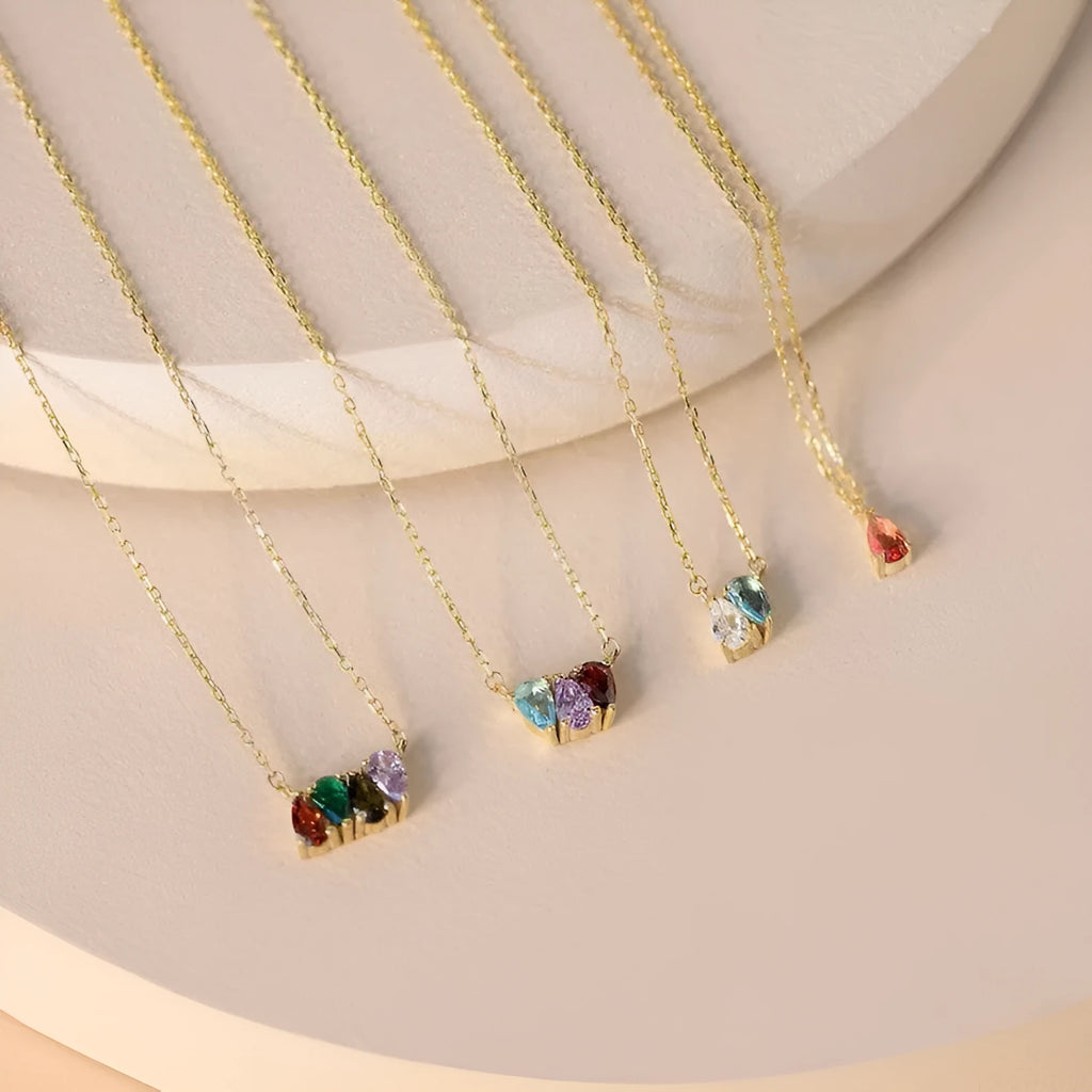 Zircon stone pendant necklace on clavicle chain in titanium steel with electroplated finish.