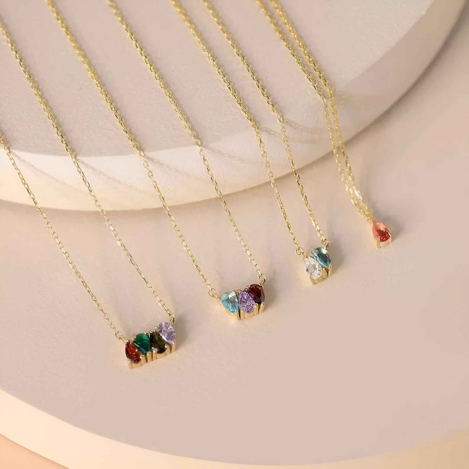 Zircon stone pendant necklace on clavicle chain in titanium steel with electroplated finish.