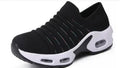 Women's stretch knitted socks shoes with mesh upper in dark blue colour showing round toe shape