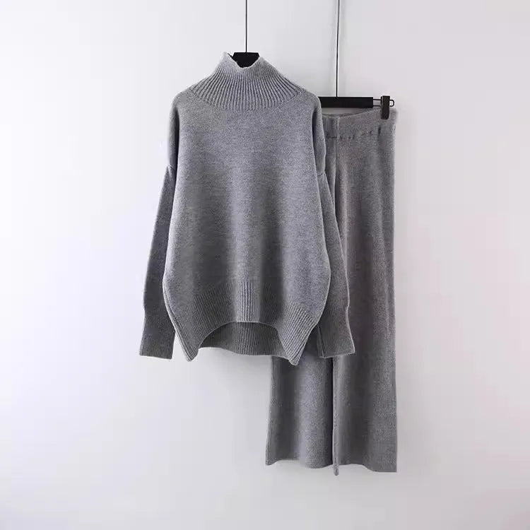 Women's milky white acrylic knit sweater and wide-leg trousers two-piece casual set.