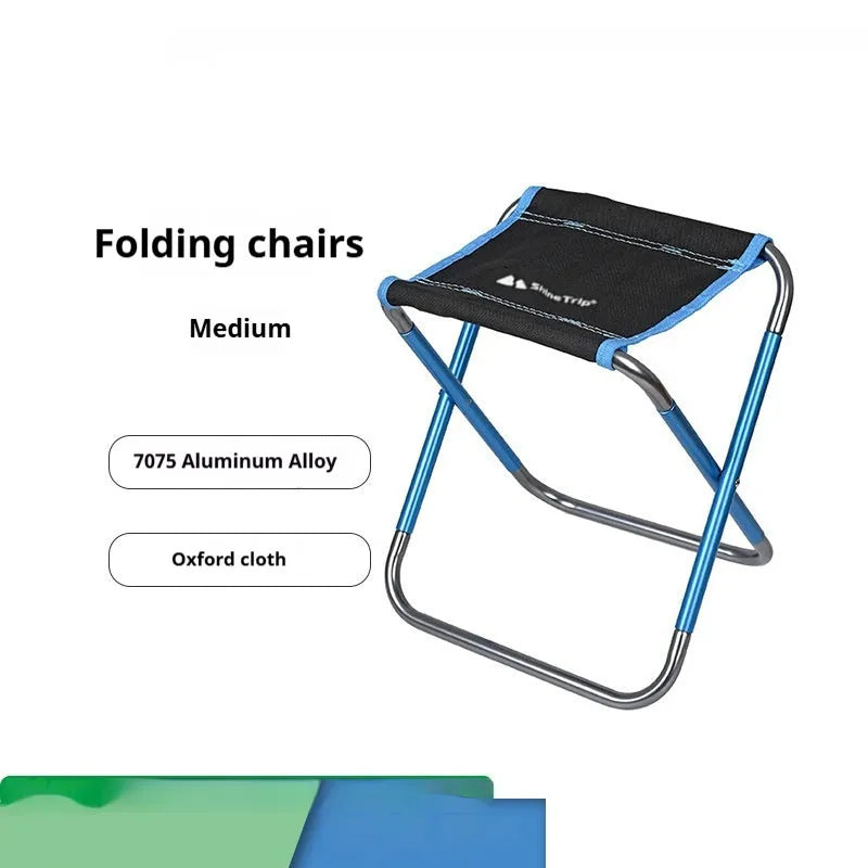 Black ethnic style aluminium alloy folding stool in open position for outdoor seating