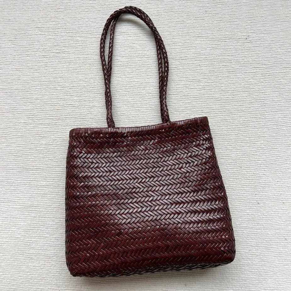 Handmade woven brown leather tote bag with three-dimensional pockets and vintage finish
