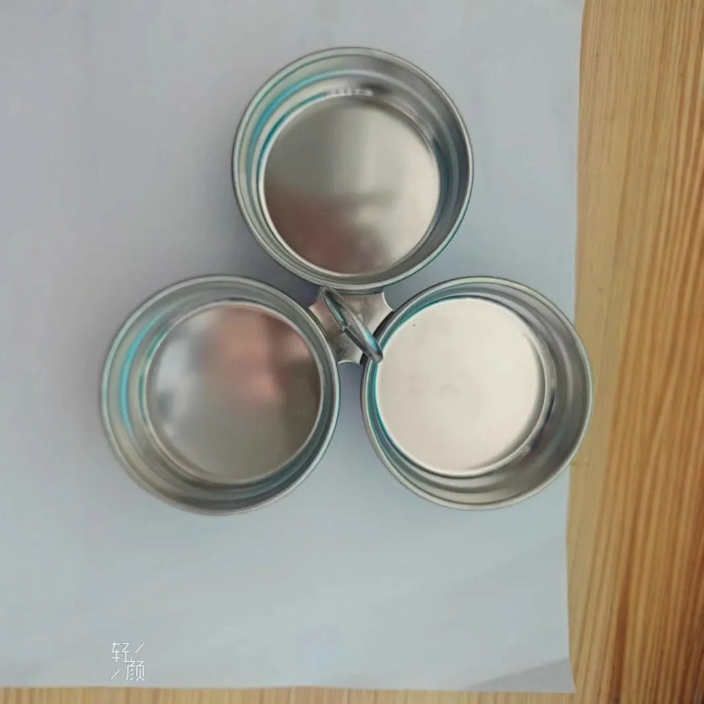 Mini stainless steel egg steamer in heart-shaped and round designs for household kitchen use.