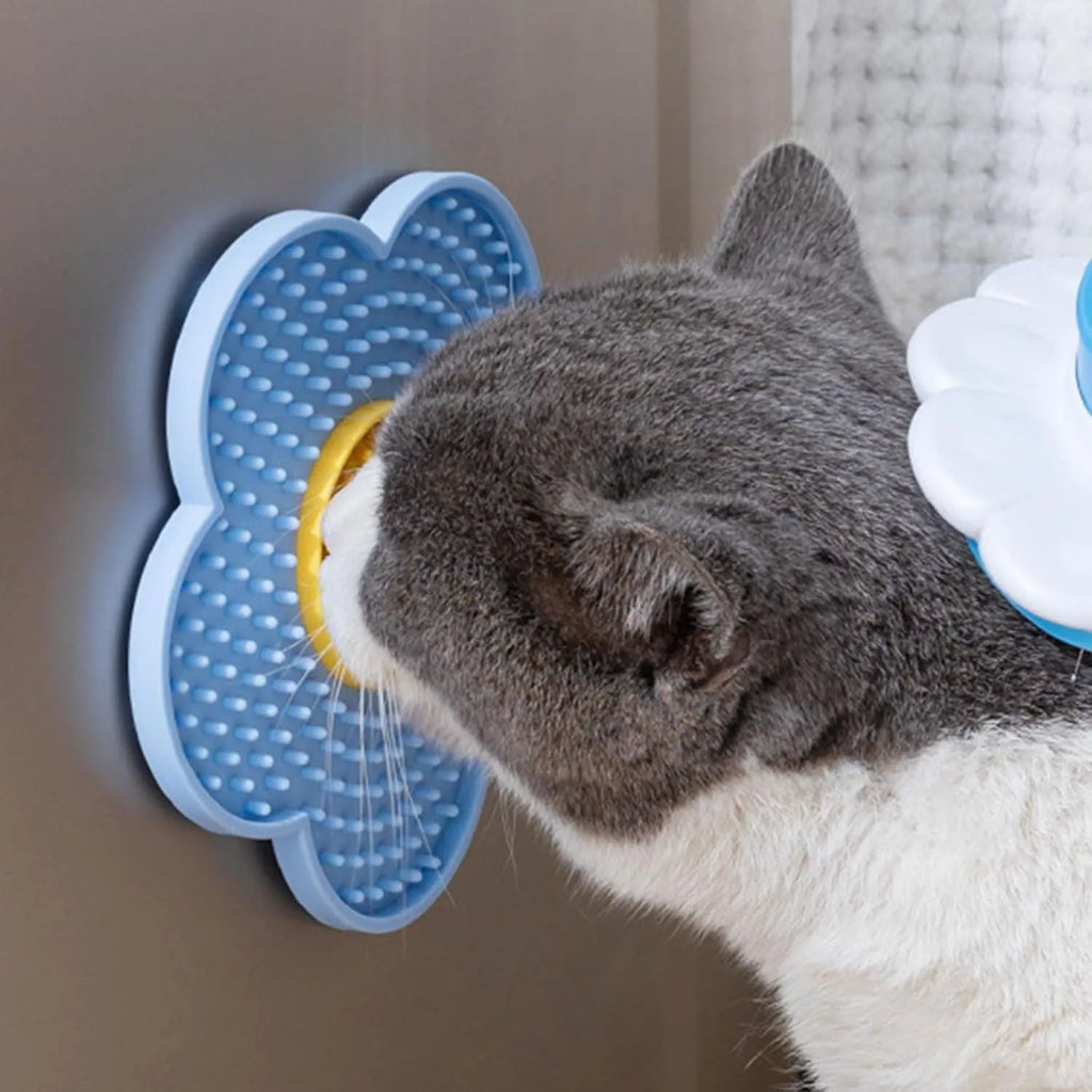 Flower-shaped silicone pet licking mat with suction cups in blue, grey, pink, purple, or red.