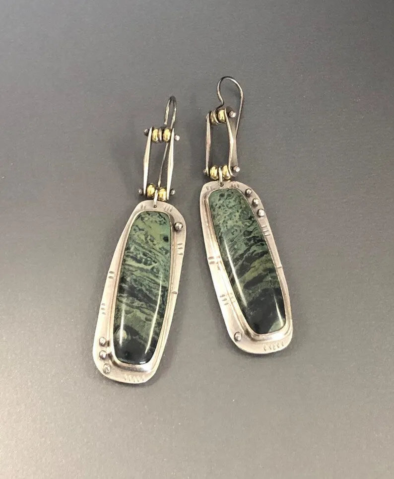 Two-tone marble pattern geometric drop earrings with alloy construction, front and side views