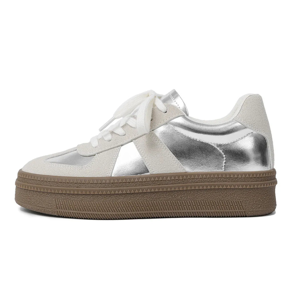 Retro-style beige casual board shoes with cross straps and round toe on a rubber sole.