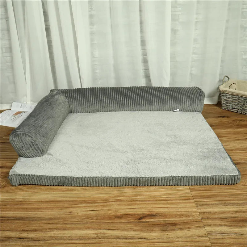 Corduroy pet dog sofa bed in grey colour with a bilateral bolster, shown on a wooden floor.