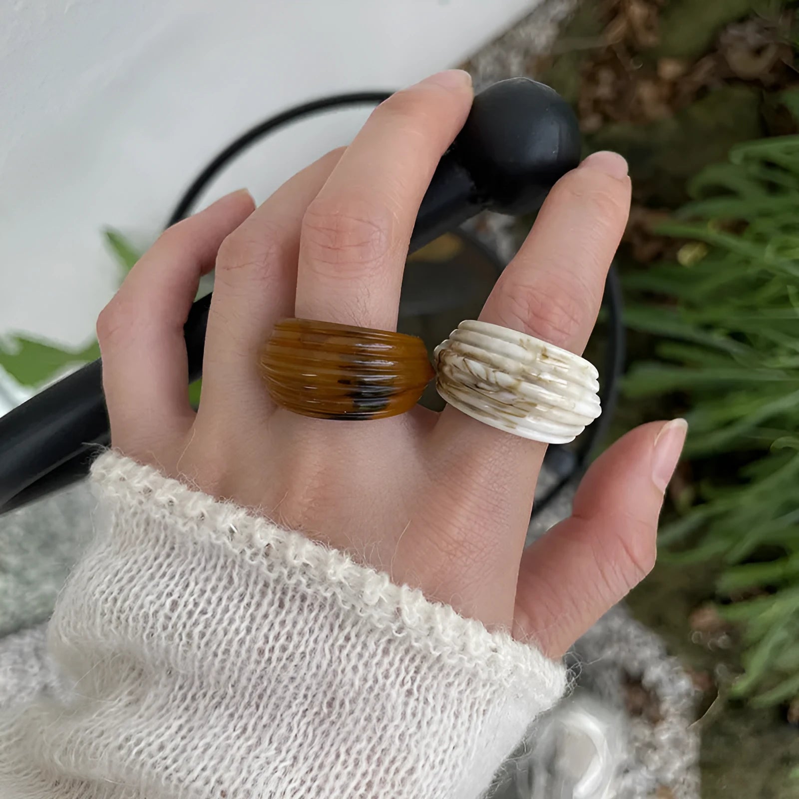 Chinese style irregular geometric resin ring in wide band design showing brown and white colour options
