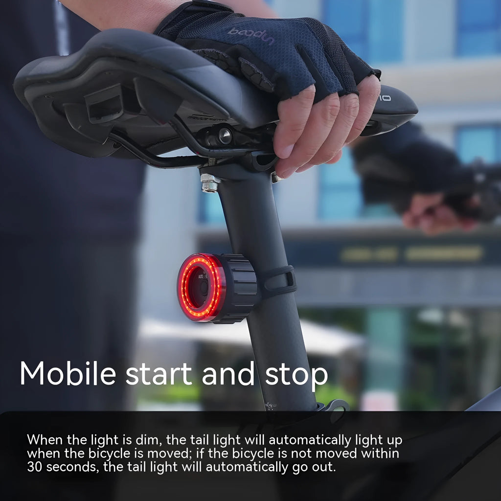 Black intelligent bicycle brake taillight with aluminum alloy frame and seat tube bracket.