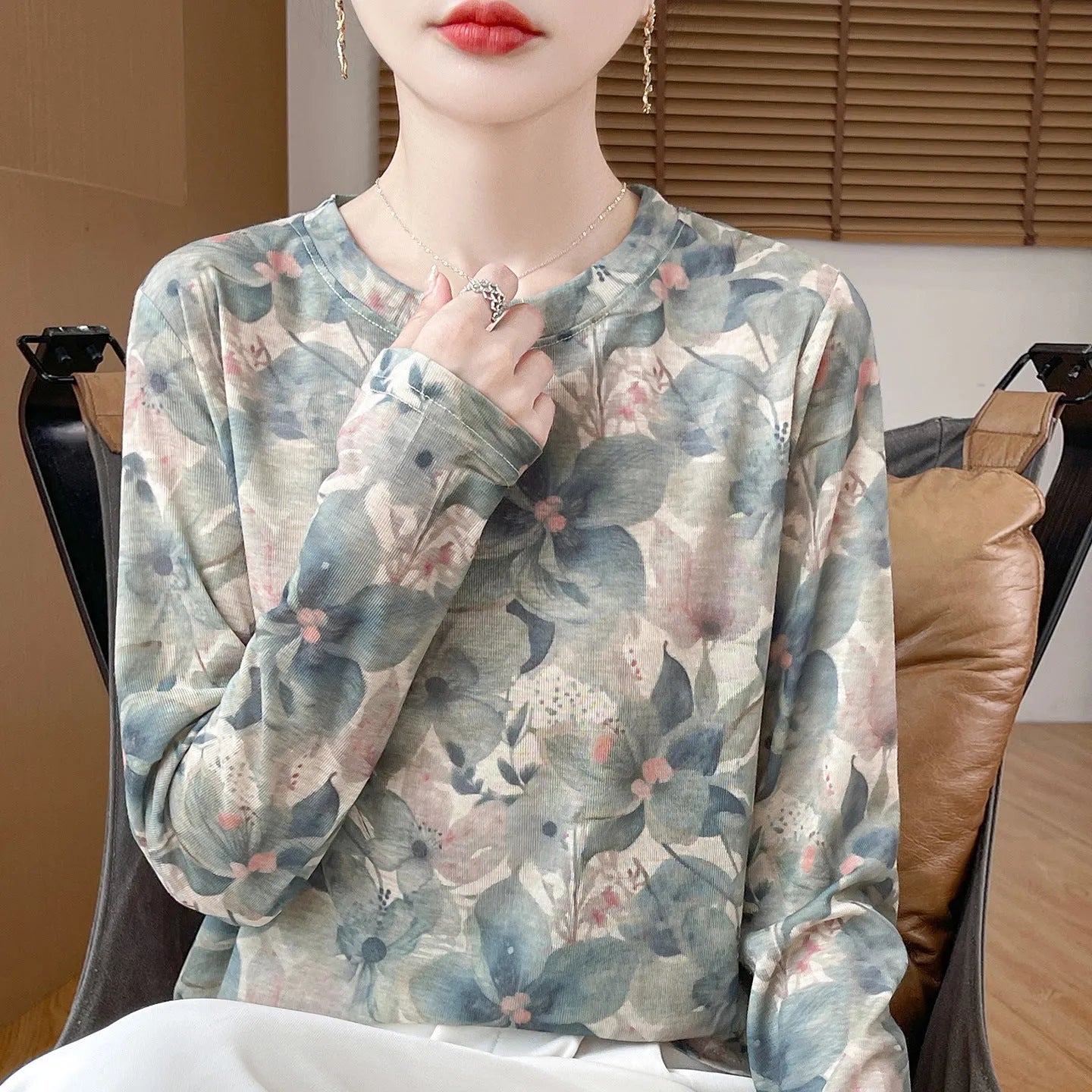 Women's round neck knit pullover shirt with artistic floral print in Tencel cotton fabric.