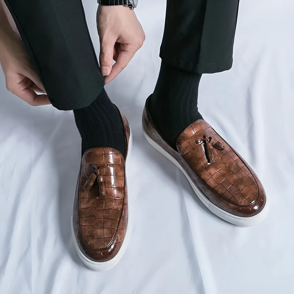 Men's plus size leather-look sneakers with tassel decoration in black, available in sizes 38 to 47