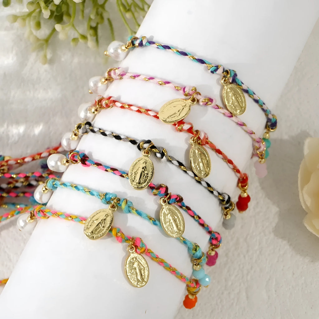 Close-up of a colourful hand-woven braided rope bracelet styled as an ethnic accessory for women.