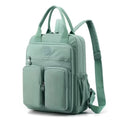 Large soft nylon waterproof backpack in grey, open to show internal laptop, camera, and phone compartments.