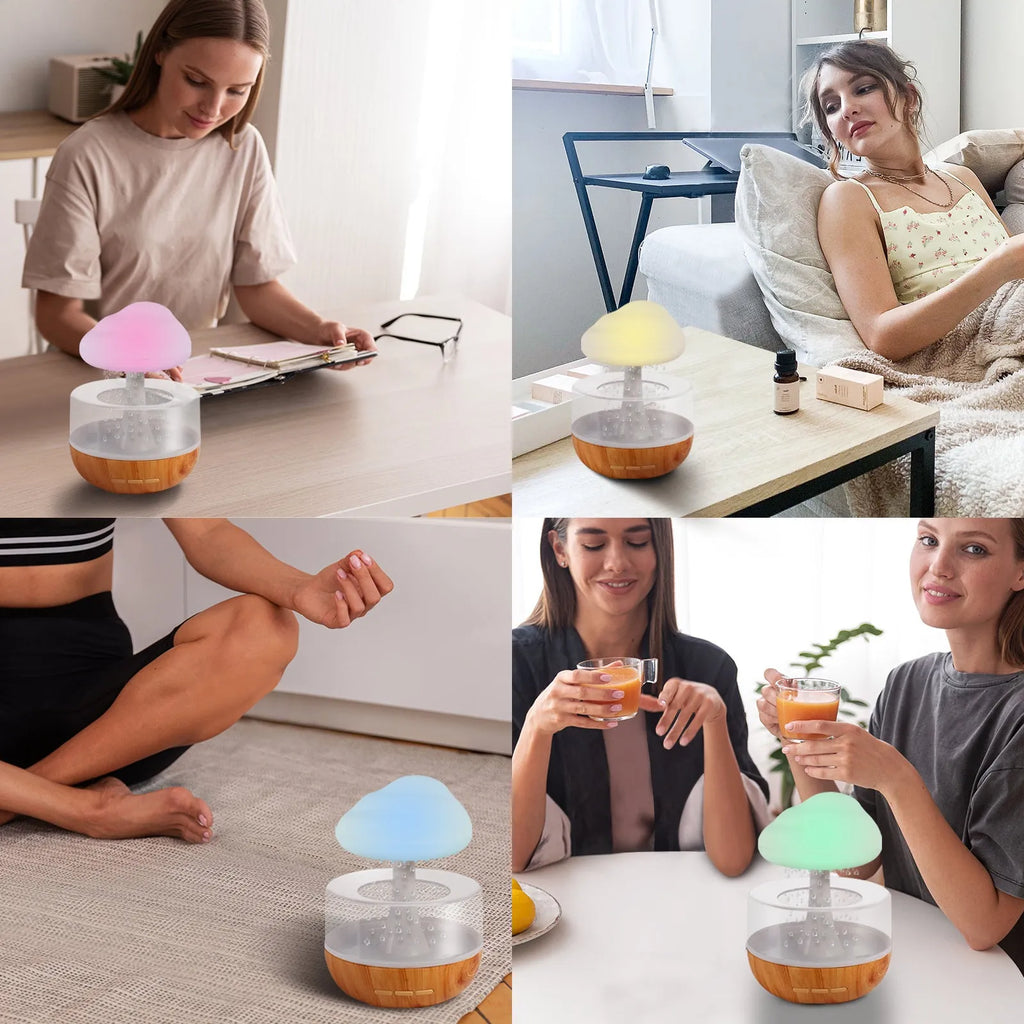 White cloud-shaped portable humidifier with coloured night light on a wooden table.