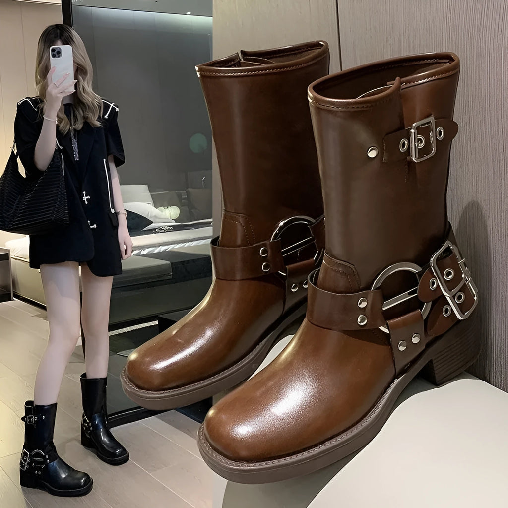 Women's black platform boots with belt buckle decoration at mid-calf length